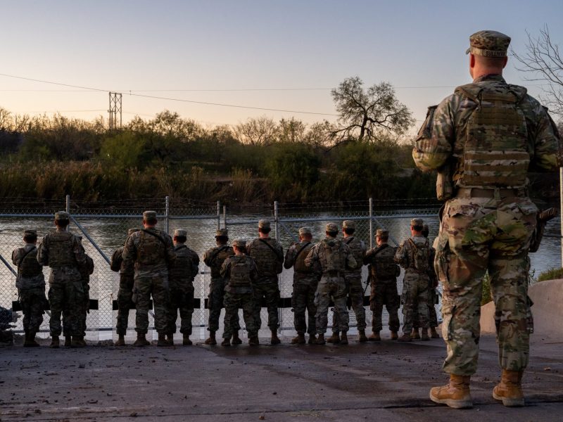 National Guard soldiers stand guard on the banks of the Rio Grande river at Shelby Park on January 12, 2024 in Eagle Pass, Texas.