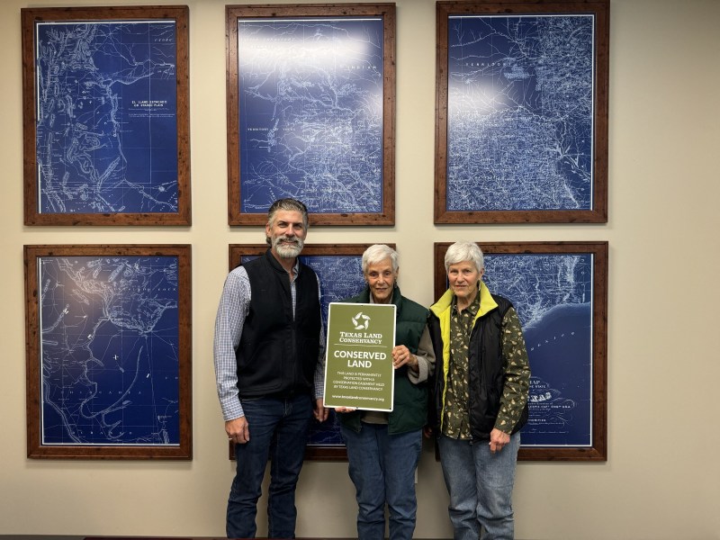 Texas Land Conservancy Executive Director Mark Steinbach (left) with sisters Mary and Bebe Fenstermaker, landowners of Maverick Ranch-Fromme Farm.