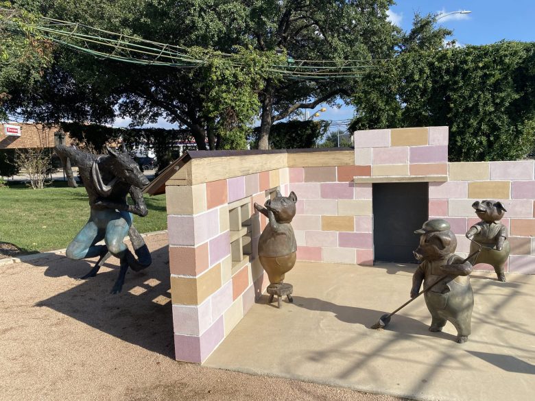 The Three Little Pigs sculpture by Steve Neves is a highlight of the Adamson-Spalding Storybook Garden.