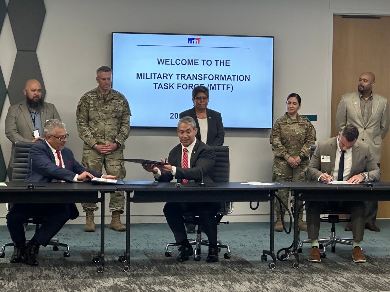 Mayor Ron Nirenberg signs an agreement with officials from Joint Base San Antonio and Workforce Solutions Alamo Monday to expand workforce development services for Bexar County veterans and their families through Ready to Work.