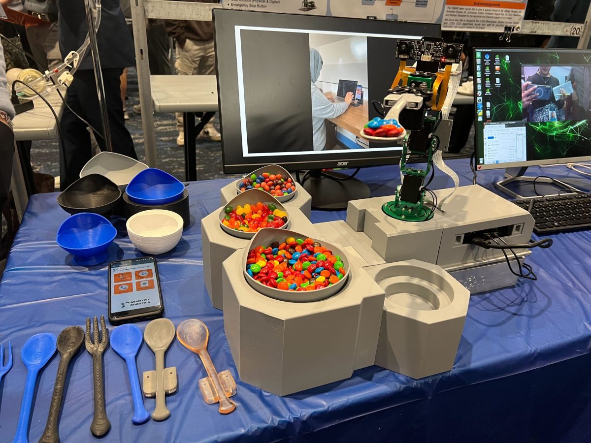 The Optimized Meal Assistance Robot (OMAR) prototype is showcased at UTSA’s Fall 2023 Tech Symposium on Friday. The robot is designed to help disabled individuals eat without a caregiver's assistance, giving them more autonomy.