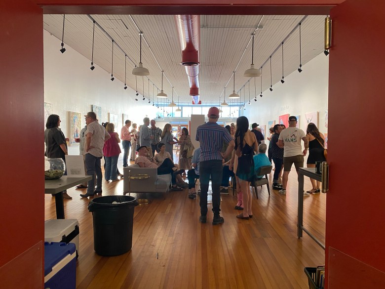 Visitors admire art in one of the galleries in Lockhart, Texas.