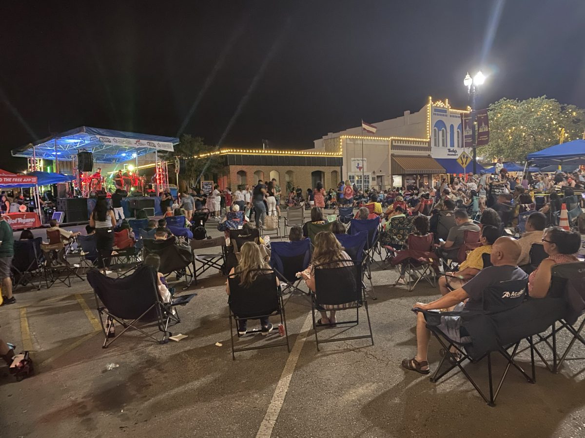 People enjoy food, drink and live music during the annual Cinco de Mayo festival in Lockhart, Texas.