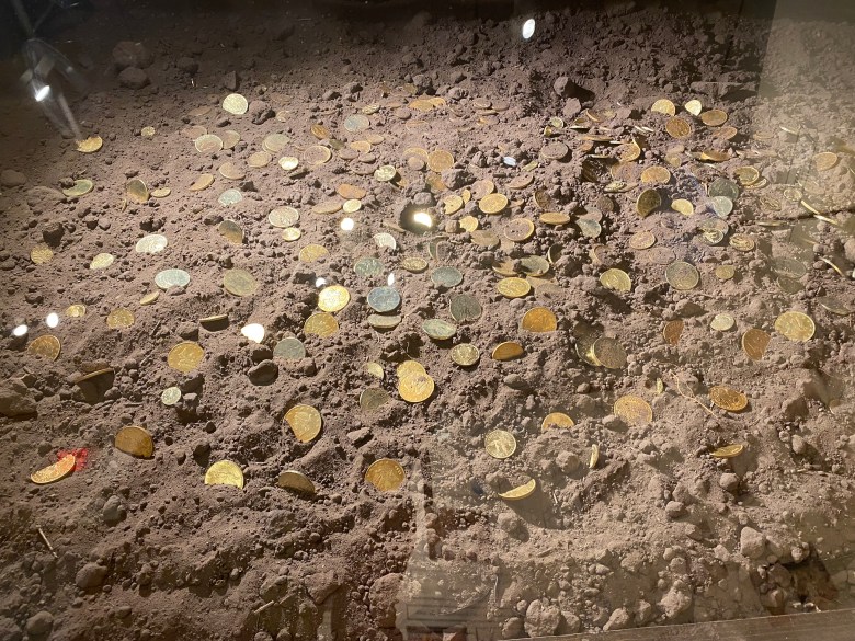 A Museum of South Texas History display replicates how a stash of gold coins were found buried beneath a house in nearby San Diego.