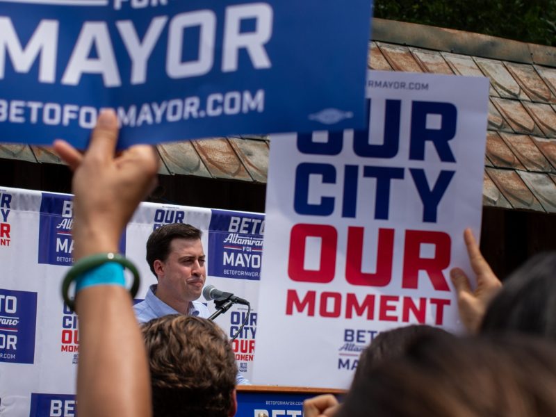 Beto Altamirano and his wife, Anna Fernandes take the stage during a mayoral campaign launch event at the Friendly Spot on Saturday.