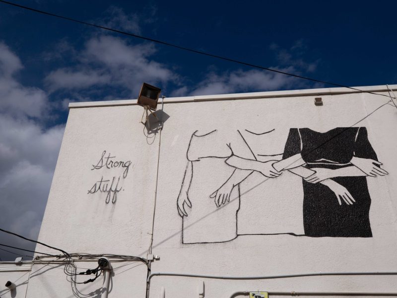 A mural is seen on the side of the Mercury Project, a collaborative studio space where artists, architects and musicians rent office spaces and tables to work.