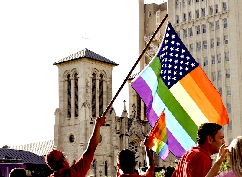 Marriage equality supporters wave LGBT rainbow flags at Main Plaza in celebration of the Supreme Court's decision that found Prop 8/DOMA unconstitutional in June 2013. Photo by Iris Dimmick.