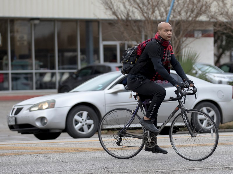 A bicyclist crosses Broadway near Army Boulevard on Monday.