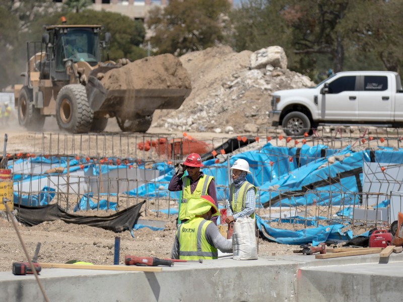 Construction workers continue work on Phase 1 at Civic Park on Thursday.