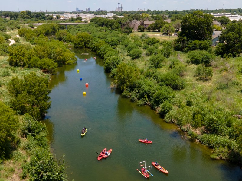 People kayak on the San Antonio River during the Mission Reach Flotilla Fiesta on Saturday.