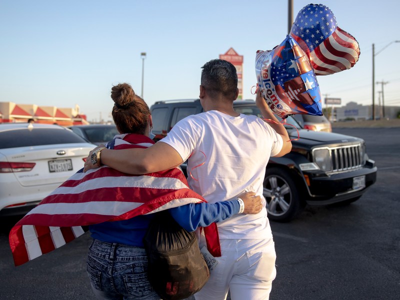 Milenes Chales, 30, of Cuba, embraces her brother, Miguel Gonzales Chales, outside of the city’s Migrant Resource Center on in July.