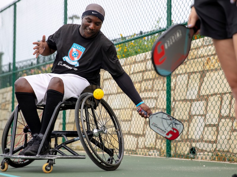 Mario Wright serves the ball while playing pickleball at Morgan’s Wonderland Sports complex on Thursday.