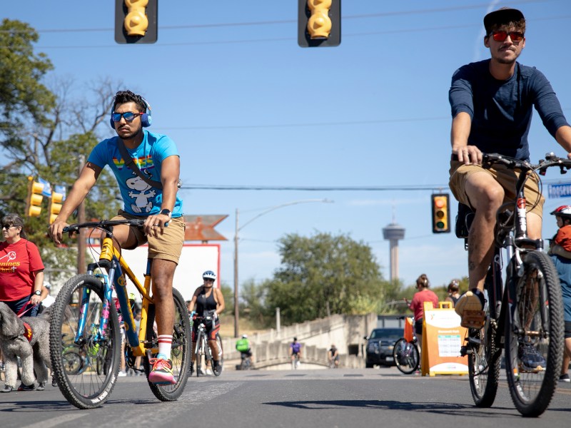 Bicyclists ride down Roosevelt Avenue during Síclovía, the YMCA’s bi-annual event that closes and turns city streets into a safe place for families and friends to exercise and play, on Sunday.