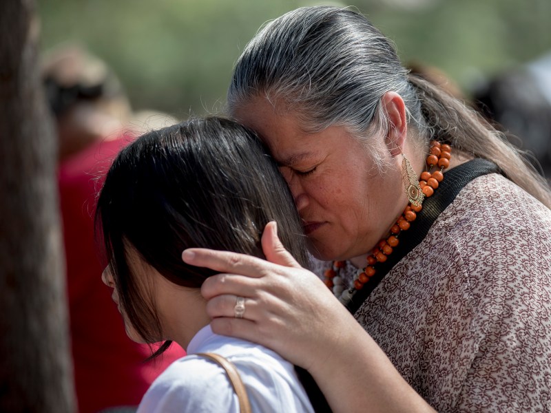 Maria Snell holds her 11-year-old daughter Lily during a rally on June 4 in San Antonio to express solidarity with the victims of the Robb Elementary School shooting in Uvalde.