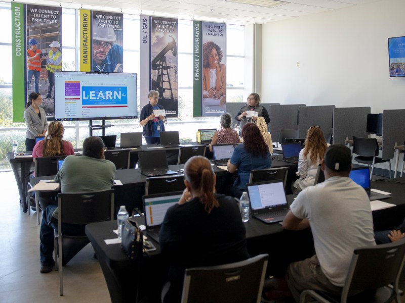 Staff members from the San Antonio Public Library host a computer literacy class at the Workforce Solutions Alamo Career Center at the San Antonio Food Bank on Friday.