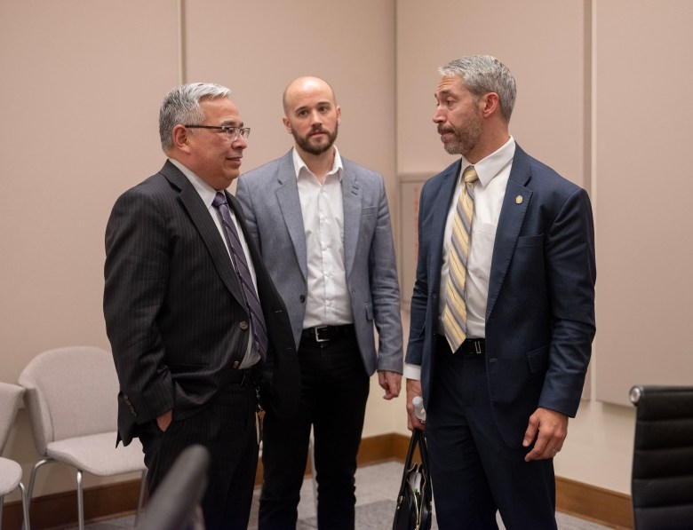 From left: City Attorney Andy Segovia, Chief-of-Staff Zack Lyke and Mayor Ron Nirenberg convene after a City Council meeting on Wednesday.