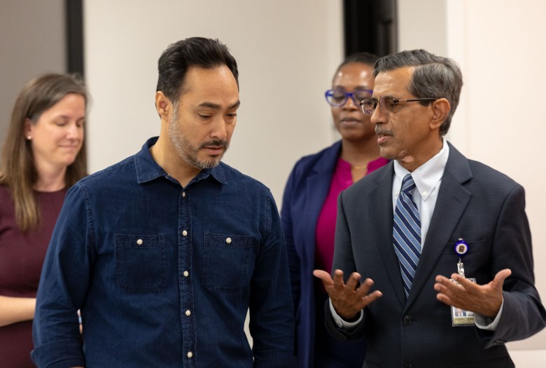 Vasan Ramachandran, MD (right) Inaugural Dean and Professor of The University of Texas School of Public Health San Antonio speaks with U.S. Rep. Joaquin Castro during a tour of the new UT Health School of Public Health.