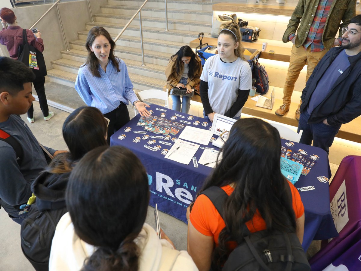 Staff members of the San Antonio Report speak with students during Youth Do Vote's Youth Voter (and Poll Worker) Fest at Palo Alto College on Tuesday.