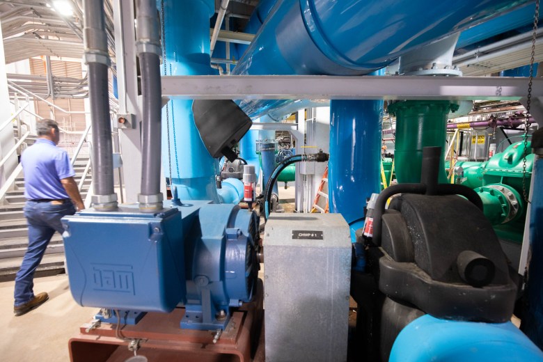 Elroy Bishop walks among large pumps that transport water throughout downtown San Antonio to multiple clients, the biggest being the Henry B. Gonzalez Convention Center and the Alamodome.