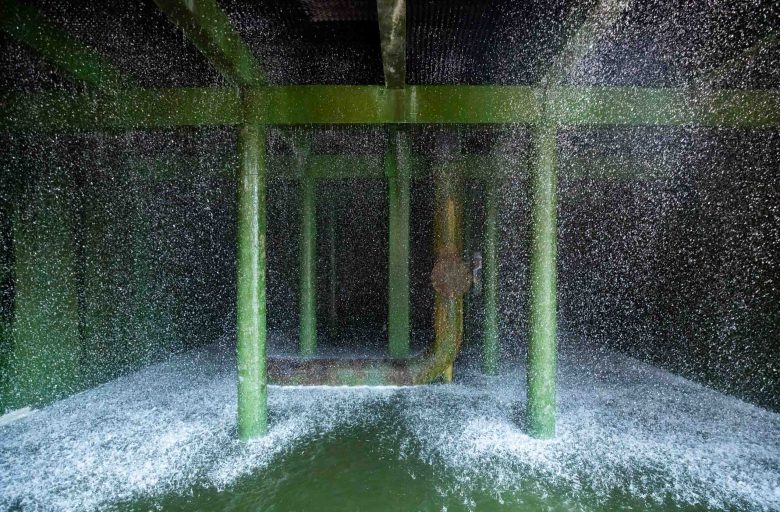 Cooling towers shower recycled water down large columns at the Cooling Plant in San Antonio.