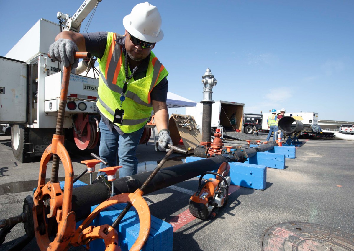 Gilbert Santos, a SAWS manager of Northeast operations for distribution and collection demonstrates how a reed cutter is used on aging cast iron pipes found much of San Antonio's inner city.