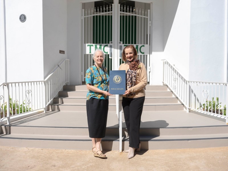 Tuesday Musical Club President Kathleen Amen, left, and Deborah Moore, co-chair of the centennial season Artist Series, hold a resolution from state Sen. José Menéndez (D-San Antonio) honoring the club's 100 years.