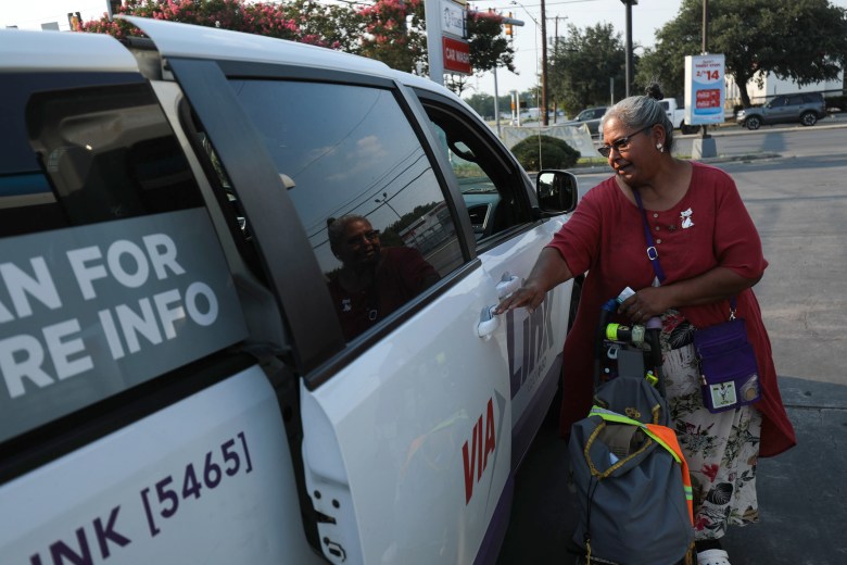 Margarita Rubio opens the door to her final ride for the day, a VIA Link shuttle, that picked her up about a block away from her original request location.