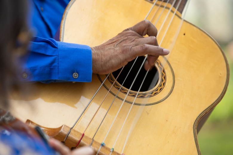 Pete Moreno Sr. plays the guitarrón Mexicano during a serenata performance. 