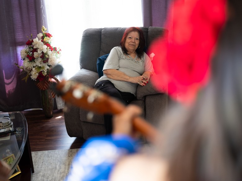  Ramona Martinez listens to Mariachi Los Parientes perform a serenata in her living room. 