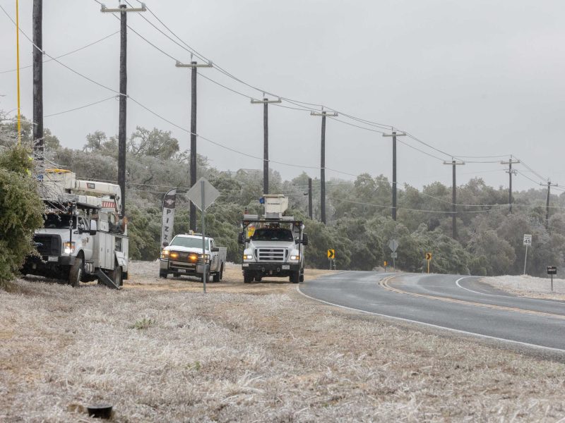 CPS Energy line crews work to restore power to customers near Fair Oaks on Wednesday morning.