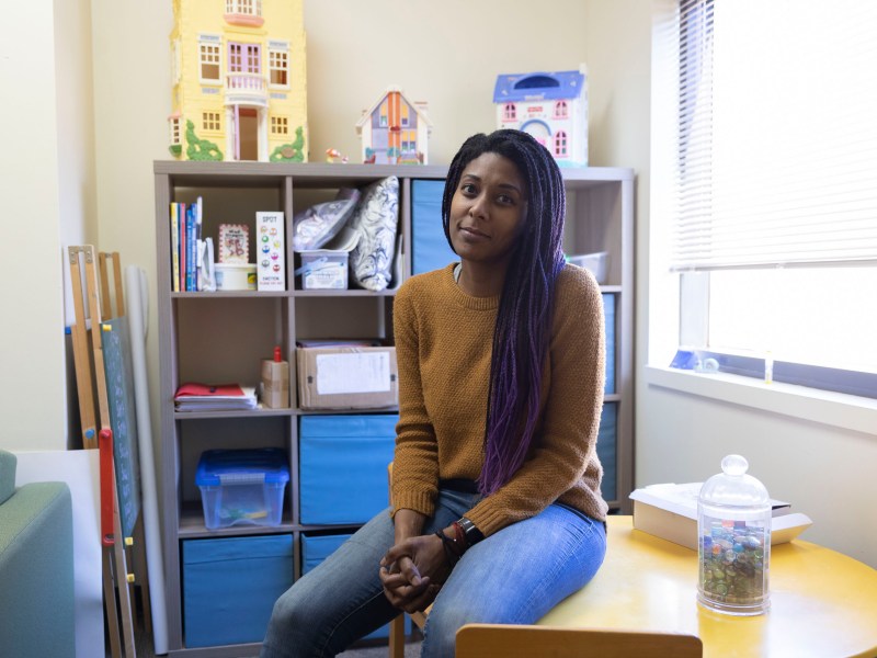 Astrid Truss, the psychiatry program manager and licensed professional counselor at Jewish Family Services sits in a counseling room where children can share their feelings through play.