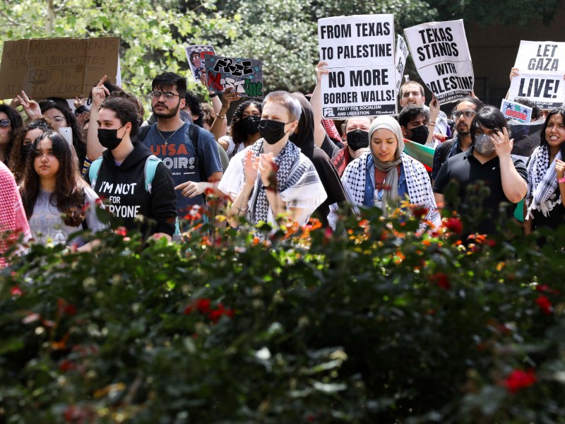 Pro-Palestinian protesters call for a ceasefire in Gaza march through the outdoor corridors of UTSA on Wednesday.