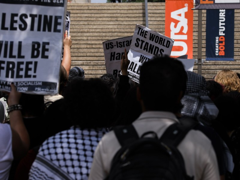 Pro-Palestinian protesters call for a ceasefire in Gaza march through the outdoor corridors of UTSA on Wednesday.