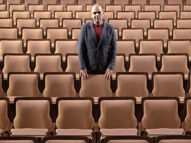 Ernie Ramirez stands in the historic Jo Long Theatre for the Performing Arts at the Carver Community Cultural Center.