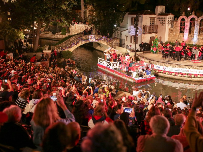 A full house at the Arneson River Theatre look on as floats pass by.