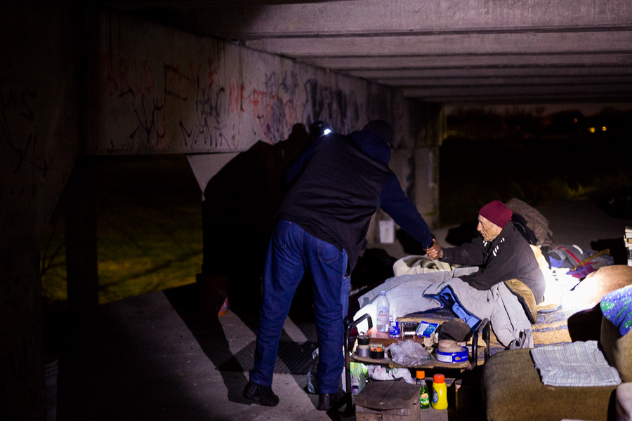 Haven for Hope Outreach Manager Ron Brown shakes the hand of John, who has been homeless for more than five years.