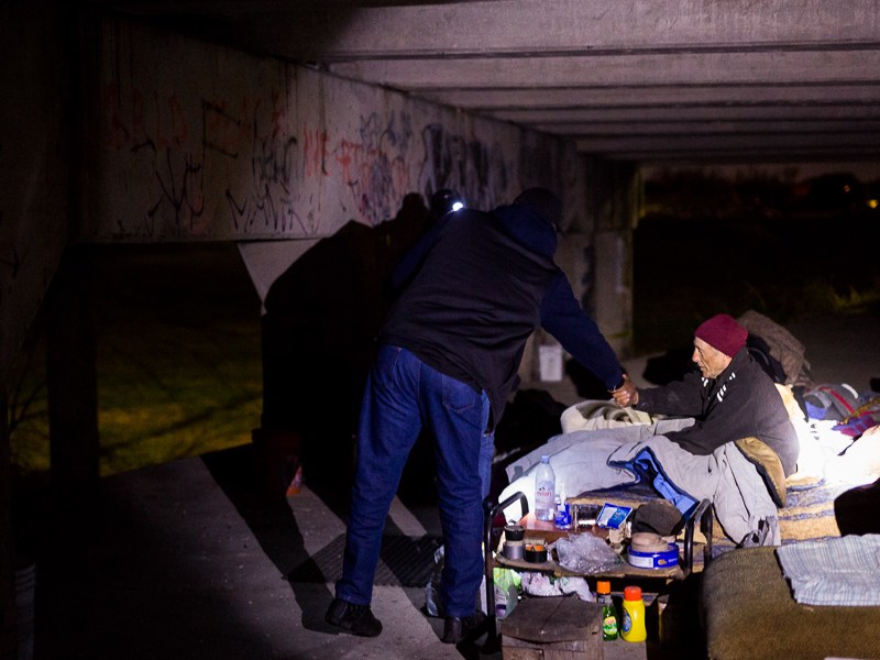 Haven for Hope Outreach Manager Ron Brown shakes the hand of John, who has been homeless for more than five years.