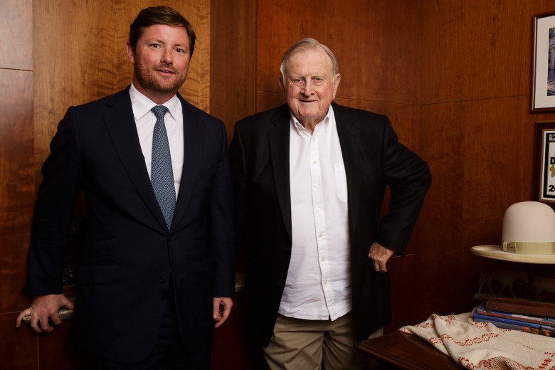 (From left) Rad Weaver and Red McCombs stand for a portrait at McCombs Enterprises.