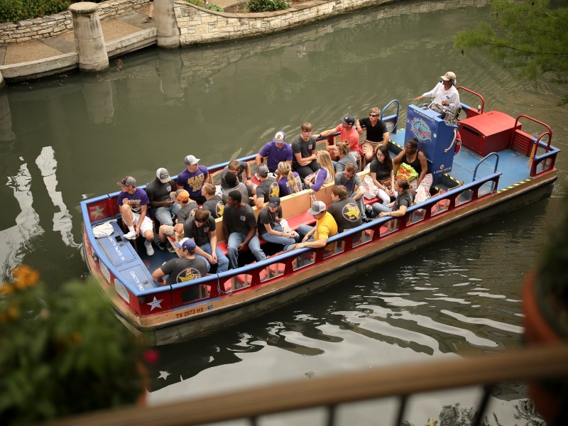 Rio San Antonio Cruises give a tour of the San Antonio Riverwalk to tourists.