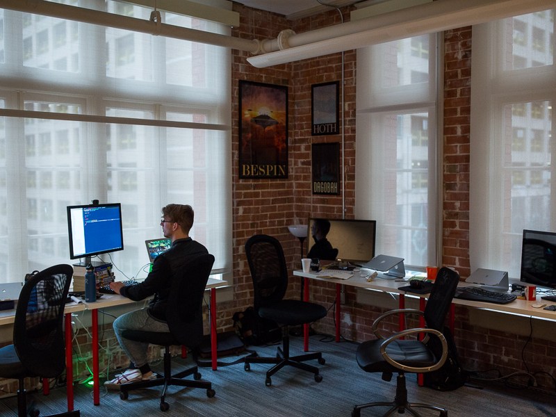 Grok Interactive Software Developer Jacob Ernst works at his desk. Photo by Scott Ball.