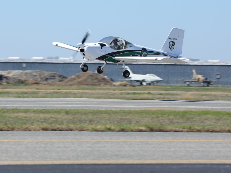 Dragon 1, an aircraft built by Southwest High School students, takes its inaugural flight at Stinson Municipal Airport on Monday.