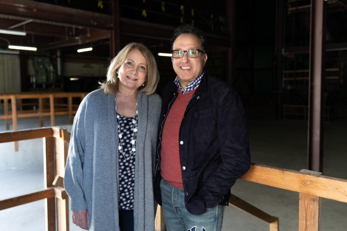 Texas Public Radio President and CEO Joyce Slocum (left) stands with Guillermo Nicolas inside the historic Alameda Theater in 2019. Nicolas made a naming-rights gift to TPR for its media center located in the nonhistoric space of the downtown theater.