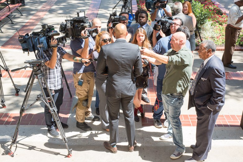 Reporters surround district two Councilman Alan Warrick. Photo by Scott Ball.