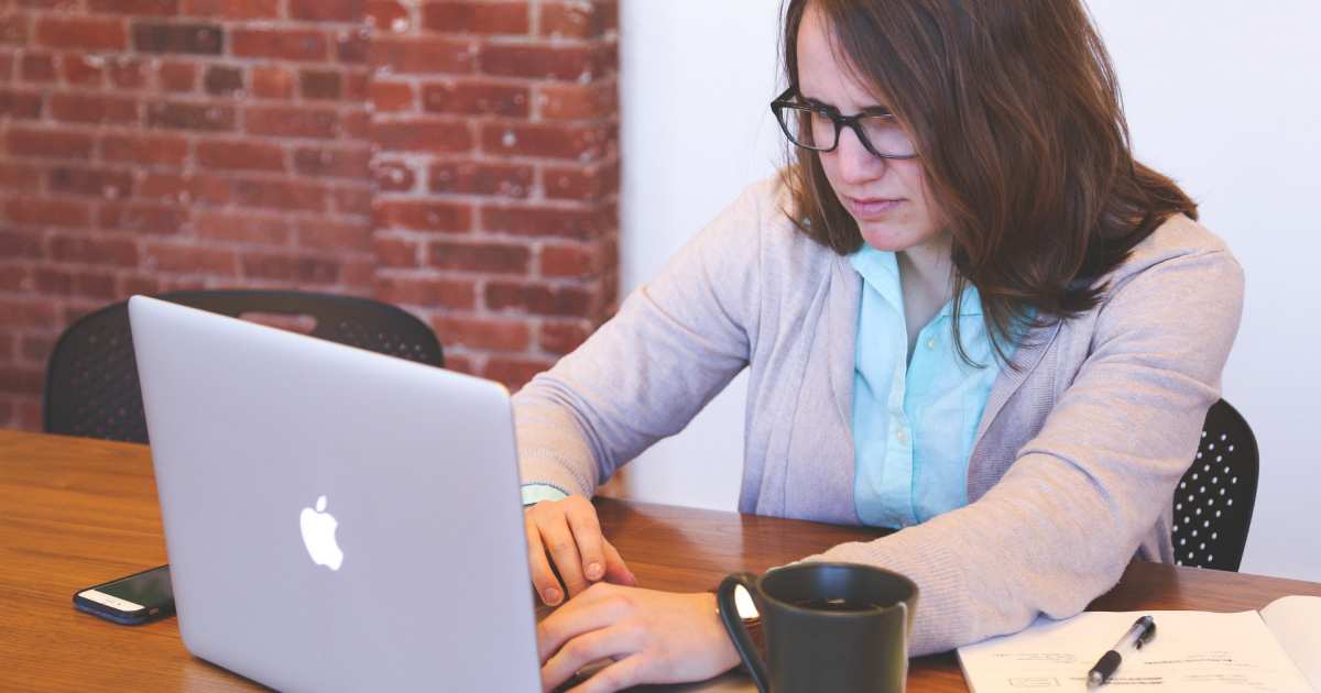 Person looks seriously at laptop