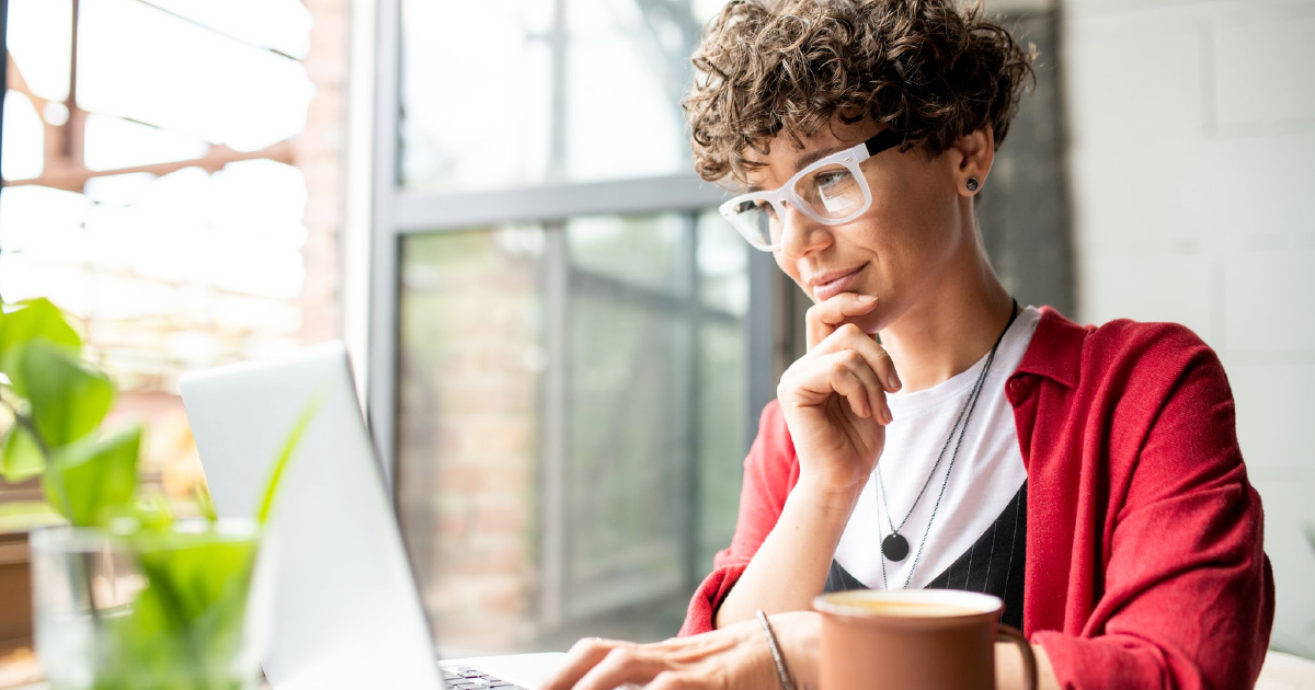 Person contemplates scorecard on computer