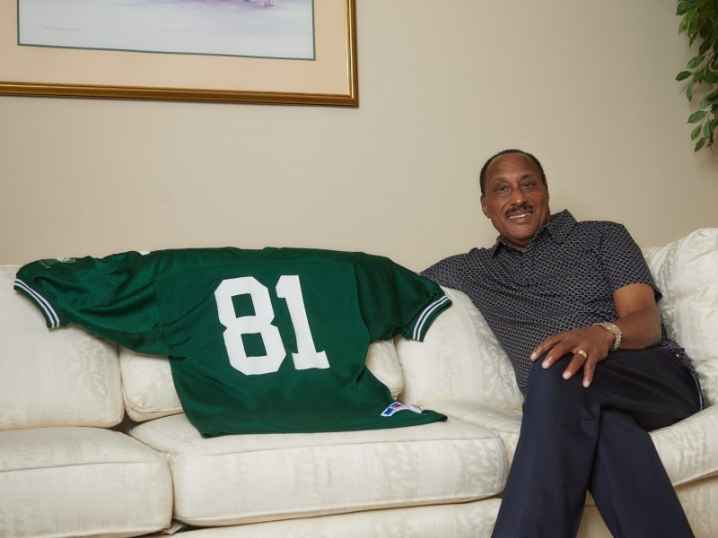 Tyrone Byrd sits next to his player jersey for the Green Bay Packers. He was signed as a free agent in 1974 however, after suffering an eye injury he was cut in the preseason.